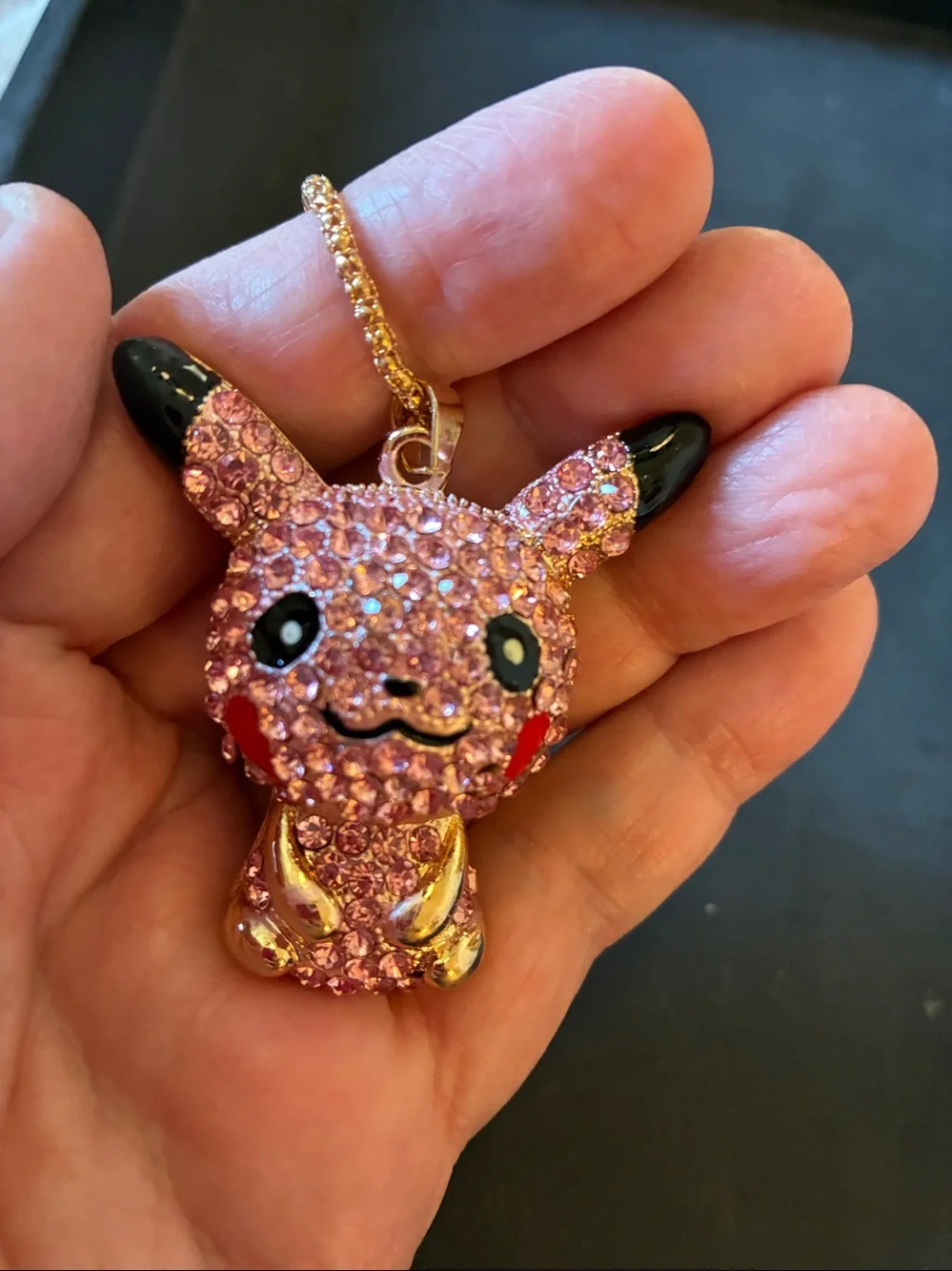 Pikachu Pink Crystal Pendant comes on a golden necklace. NWOT